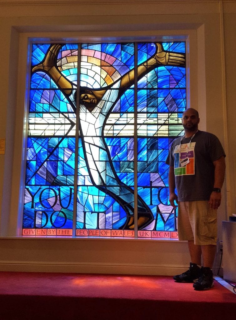 Andrew Morrell stands beside a window donated to the 16th Street Baptist Church in Birmingham, Alabama, in memory of the 1963 bombing that killed four girls and injured 22 other people.